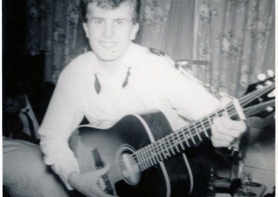 Howard playing guitar